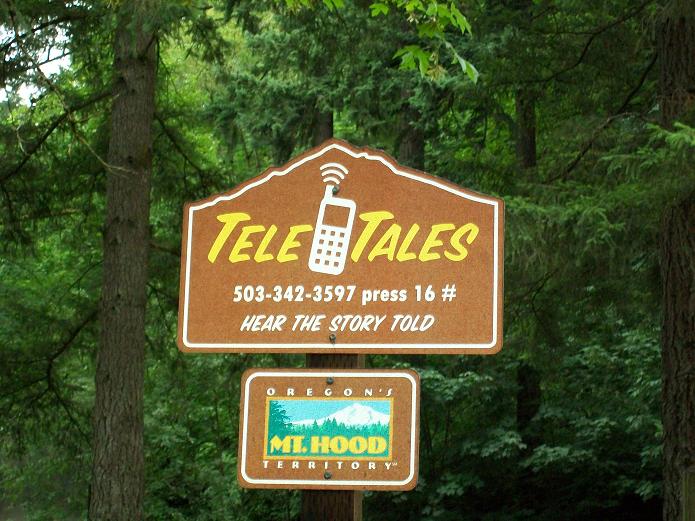 sign reading Tele Tales - Hear the story told, with a phone number